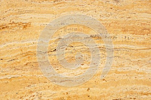 Natural stone travertine yellow color with an interesting pattern, called Travertino Giallo