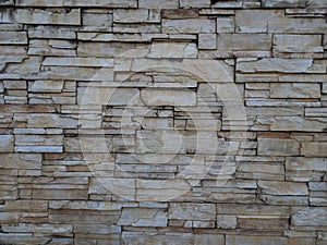 Natural stone wall texture as background for interior, exterior decoration and industrial construction concept design. Close-up