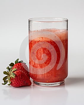 Natural Strawberries juice with white background