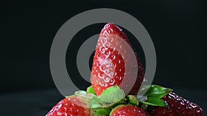 Natural strawberry fruit in a mountain of strawberries