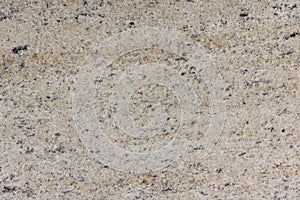 Natural structure of granite, yellow and beige, sanded board