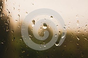 Natural summer background - raindrops on the window glass, close up.