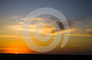 Natural Sunset Sunrise Over Field Or Meadow. Bright Dramatic Sky And Dark Ground. Countryside Landscape Under Scenic