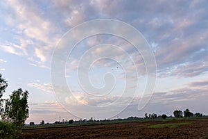 Natural sunsets over Bright Dramatic Sky and dark ground.