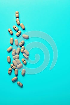 Natural Supplements scattered on a light background