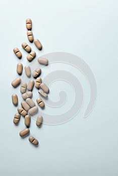 Natural Supplements scattered on a light background