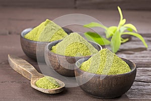 Natural sweetener in powder from stevia plant - Stevia rebaudiana. Top view