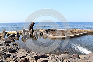 Natural swimming pool and Atlantic Ocean panorama in holiday resort Playa de las Americas on Canary Island Tenerife, Spain