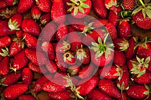 Natural texture of ripe strawberries. Banner of strawberries in a wooden box close-up and copy space