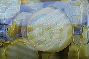 natural texture of round green pieces of canned zucchini