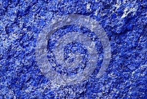The natural texture of the stone is colored blue.