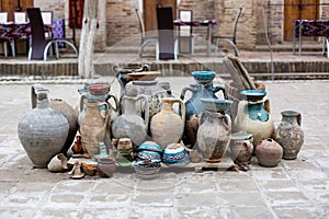 Natural traditional clay pottery beautiful old kitchen appliances, dishes, jugs, vases, pots, mugs. The background.