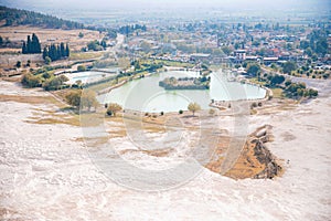 Natural travertine pools pool without water drought and terraces in Pamukkale Turkey