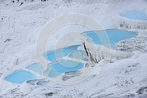 Natural travertine pools and terraces in Pamukkale. Cotton castle in southwestern Turkey. Pamukkale travertine and ancient city of