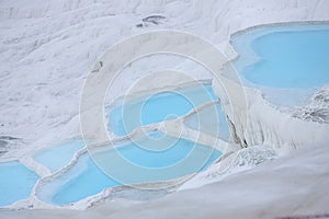 Natural travertine pools and terraces in Pamukkale. Cotton castle in southwestern Turkey. Pamukkale travertine and ancient city of