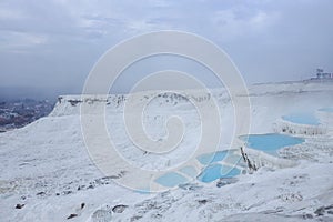 Natural travertine pools and terraces in Pamukkale. Cotton castle in southwestern Turkey. Pamukkale travertine and ancient city of