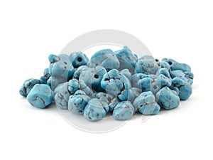 Natural turquoise beads on a white background