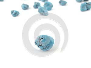 Natural turquoise beads on a white background
