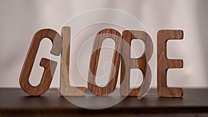 Natural Typography: Wooden 3D Letters Spell \'Global\' on Table