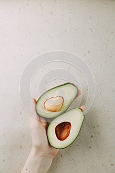 Natural vegetarian food. Ripe avocado in your hands