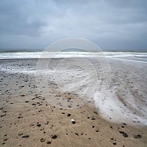 Natural view of the beach in Bjerregard, Denmark under a cloudy sky