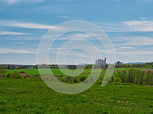 Natural view of greenfields in the countryside under a wispy sky