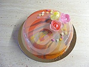 Natural view of grenadine mouss cake with mirror glass in spring style