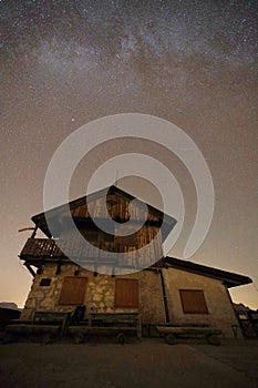 Natural view of Milky Way Galaxy over the Dolomites Mountains. On exposure shot