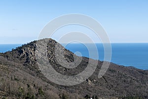 Natural view of a vast mountainous landscape under a clear sky background
