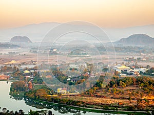 Natural viewpoint, mountains, hills, forests and river under morning mist