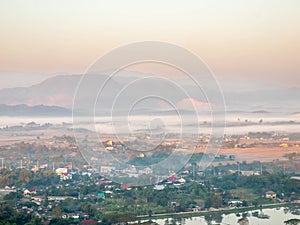 Natural viewpoint, mountains, hills, forests and river under morning mist