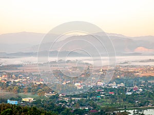 Natural viewpoint, mountains, hills, forests and river under morning mist