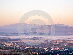 Natural viewpoint, mountains, hills, forests and river under morning mist