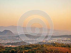 Natural viewpoint, mountains, hills, forests and river under morning mist