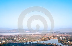 Natural viewpoint, mountains, hills, forests and river under morning mist