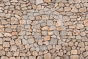 Old grey natural stone wall