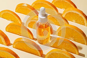 Natural vitamin c serum, skincare, essential oil products. Bottle of vitamin C serum with fresh juicy orange fruit