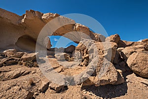 Natural volcanic rock arch formation in desertic landscape in Tenerife, Canary islands, Spain.