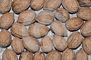 Natural walnut background pattern texture Abstract walnuts heap pattern background Blurred edges frame