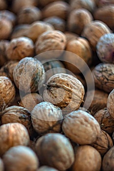 Natural walnut background pattern texture Abstract walnuts heap pattern background Blurred edges frame Natural food in-shell nuts