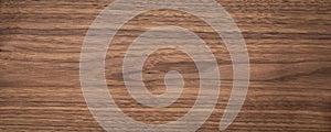 Natural walnut grain with beautiful wood grain. Walnut long planks texture. Walnut wood texture background.