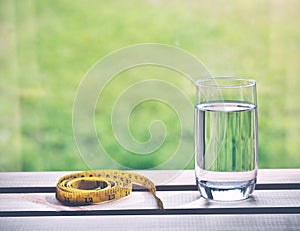 Natural water and yellow measuring tape