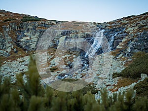 A natural waterfall by a hiking trail in the Tatras in Slovakia