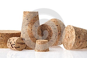 Natural wine cork closeup. Several natural wine corks on white