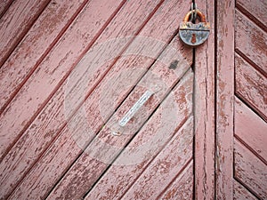 Natural wood plank shabby chic texture background with old padlock
