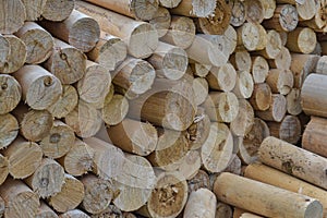 Natural wooden background - chopped firewood. Firewood stacked and prepared for winter. Pile of wood logs