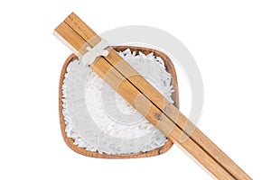 Natural Wooden chopsticks with rice in small wooden bowl