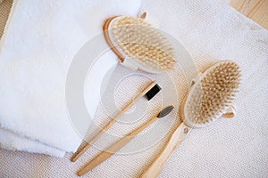 natural wooden massage brushes and dental brushes on the background