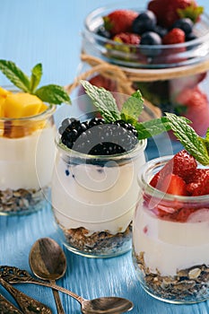 Natural yogurt with muesli, mango and berries.