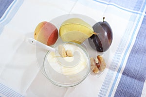 Natural yogurt or yoghurt with cream, fruits and nuts